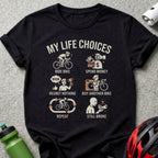 Black t-shirt displaying "My Life Choices" with four panels depicting bike riding and finances.