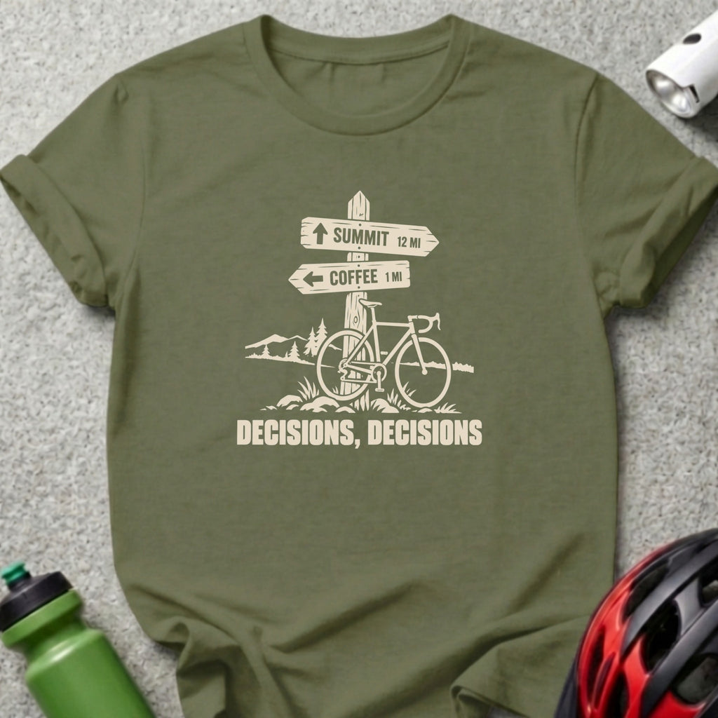 An olive green t-shirt featuring a cream graphic of a bicycle, a trail sign, and the text DECISIONS, DECISIONS.