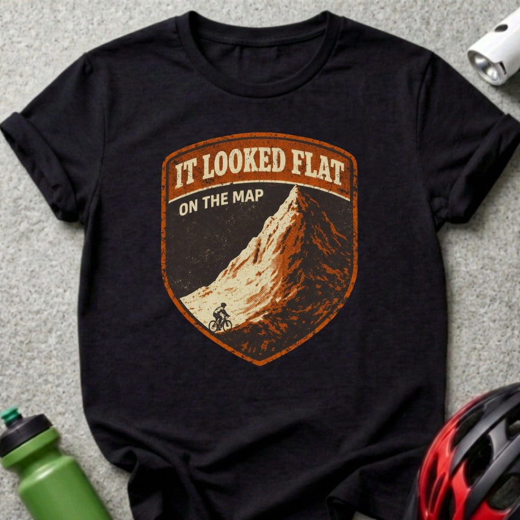 Black t-shirt with "It looked flat on the map" mountain biker badge graphic.