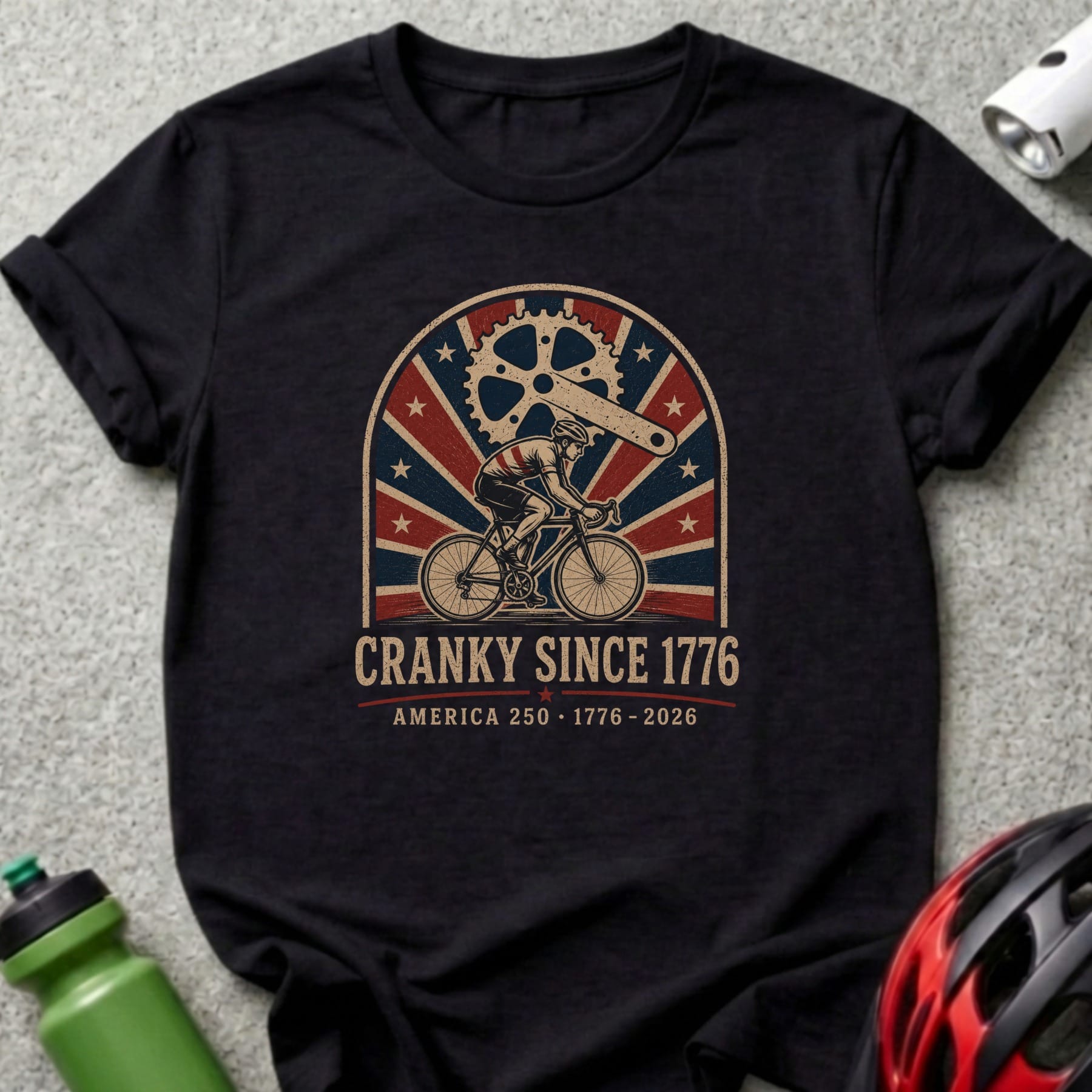 T-shirt with cyclist, gears, and "Cranky Since 1776 America 250".