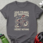T-shirt with dog riding a bicycle, "250 Years of Freedom," "I Regret Nothing."