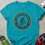 Turquoise t-shirt with "SPOKESWOMAN" text and woman cycling graphic.