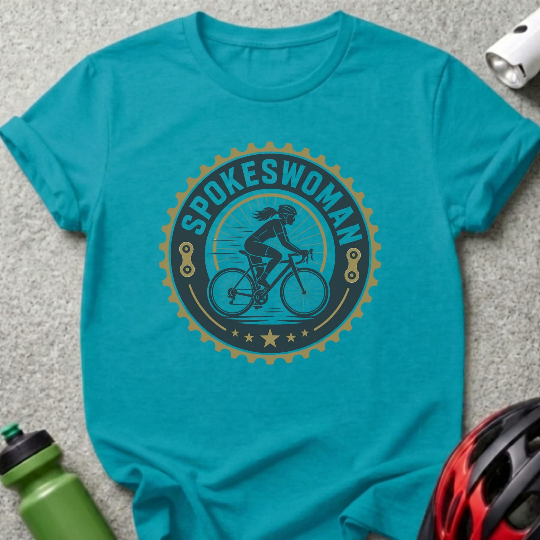 Turquoise t-shirt with "SPOKESWOMAN" text and woman cycling graphic.