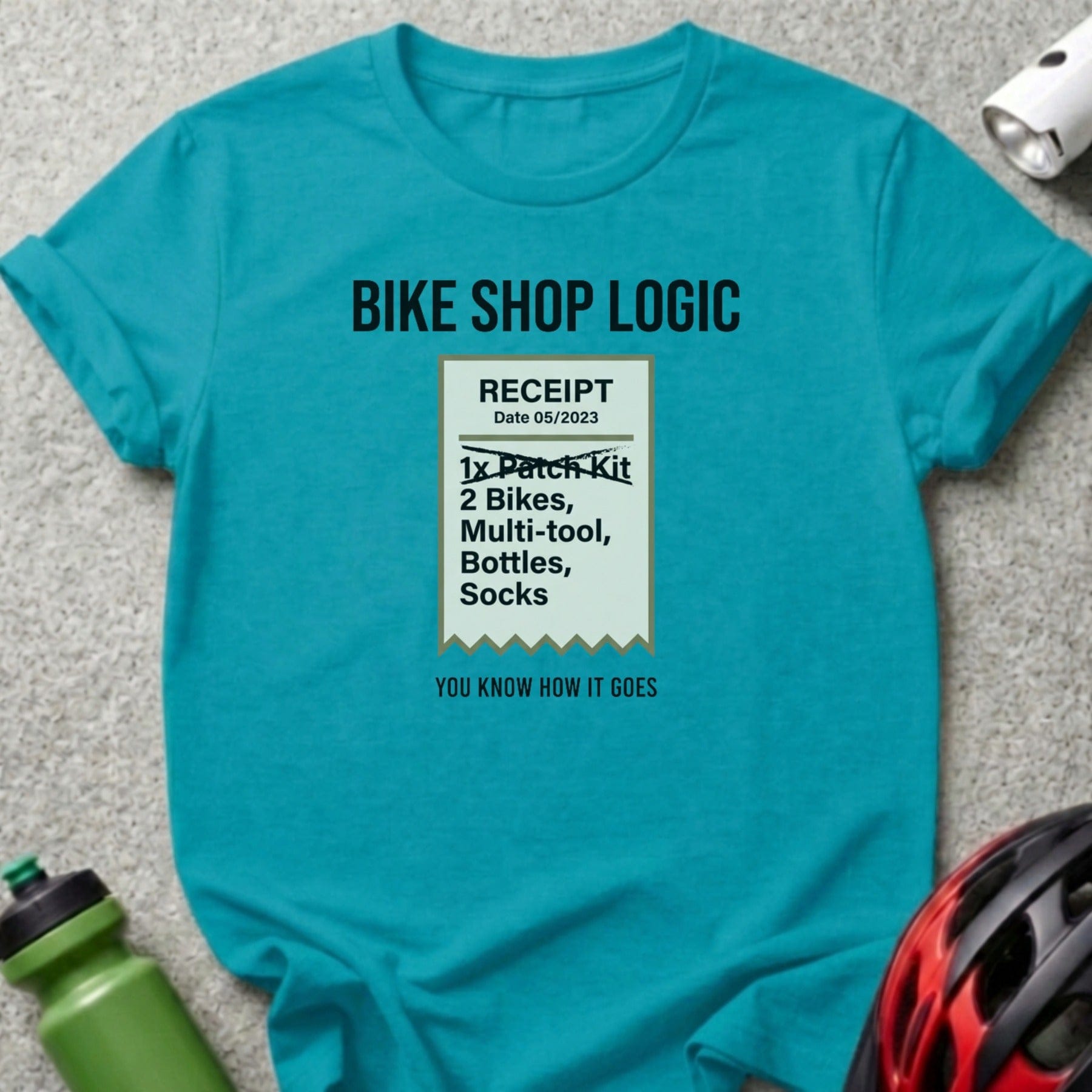 Turquoise t-shirt with "Bike Shop Logic" receipt graphic.