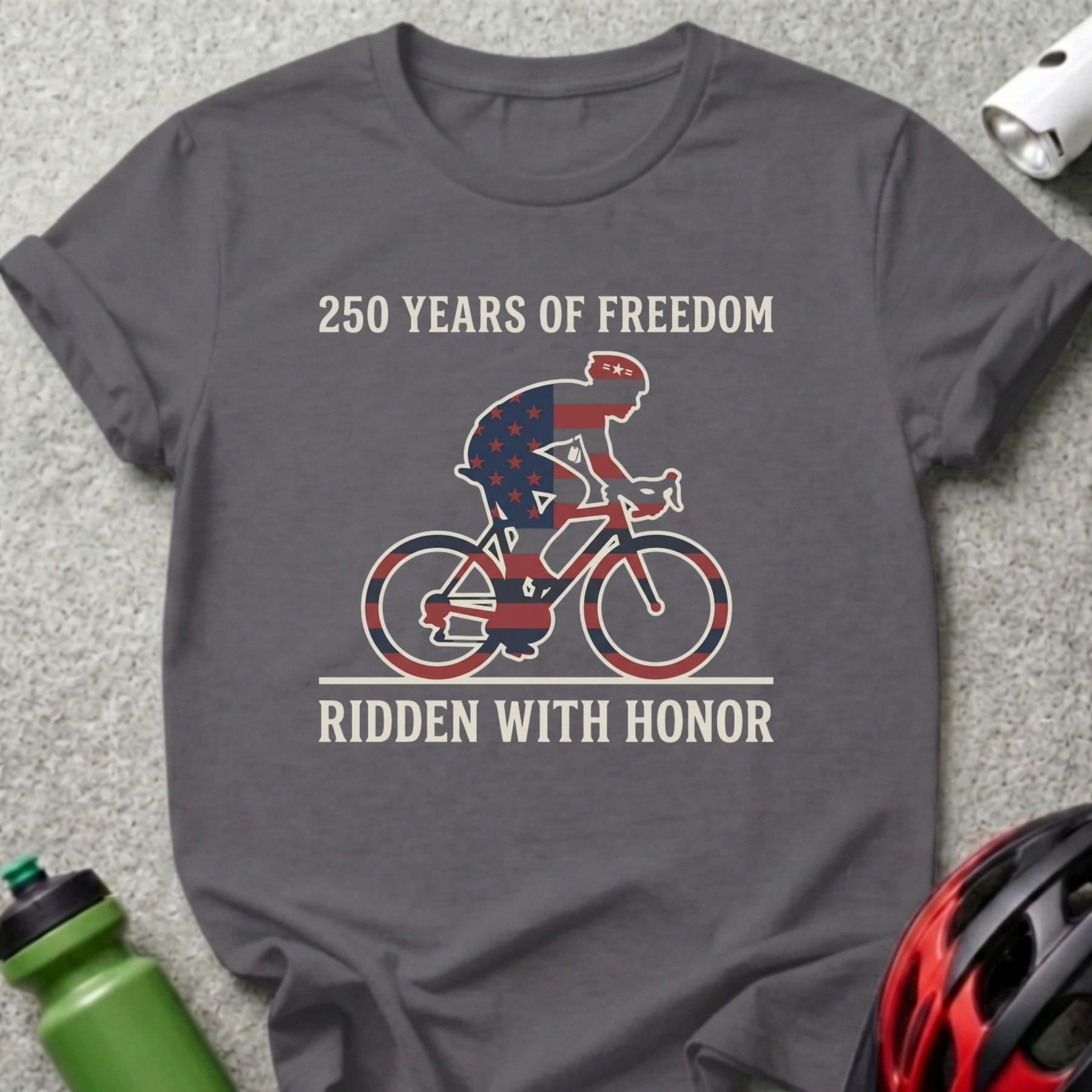 Dark gray t-shirt with cyclist graphic and text "250 YEARS OF FREEDOM RIDDEN WITH HONOR".
