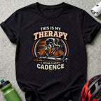 Black t-shirt with "This is my therapy I speak fluent cadence" and cyclist graphic.