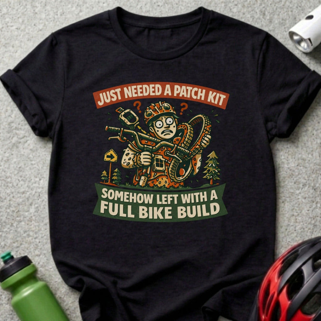 T-shirt with comic graphic saying "Just needed a patch kit, somehow left with a full bike build."