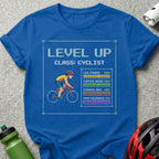 Blue t-shirt with "Level Up Cyclist" graphic showing stats.