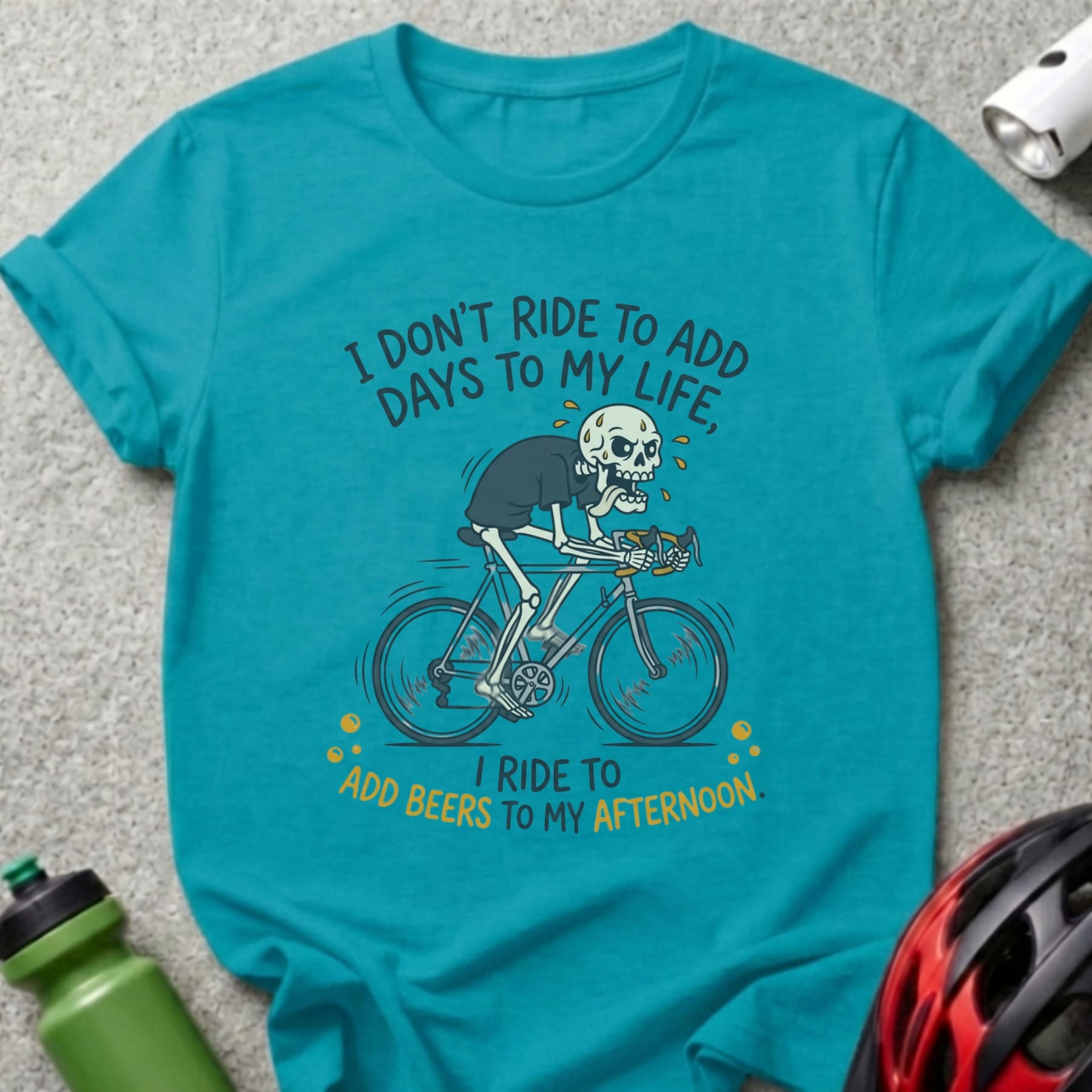 Skeleton riding a bicycle with text "I don't ride to add days to my life, I ride to add beers to my afternoon."