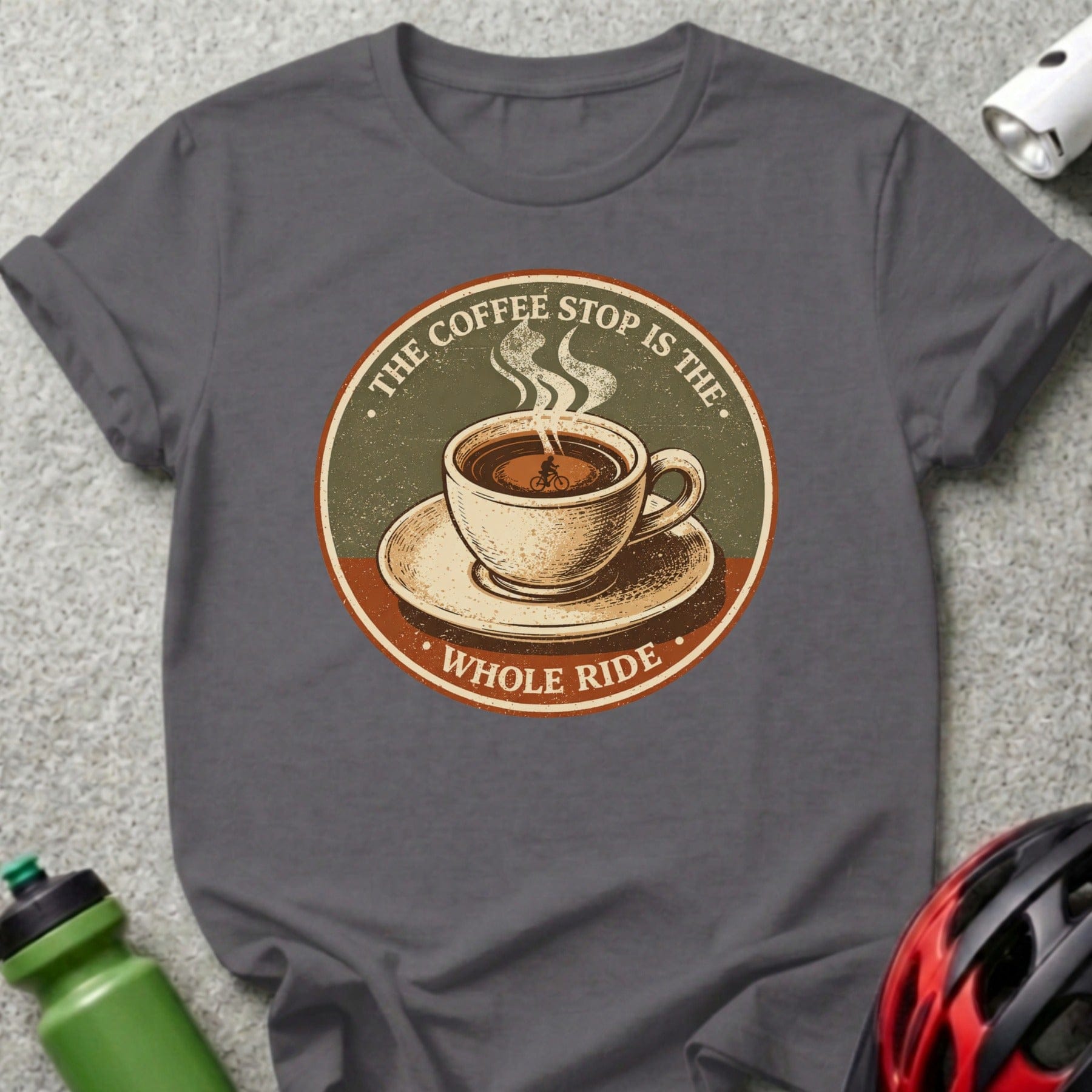 T-shirt graphic with coffee cup and bicycle, "The Coffee Stop Is The Whole Ride".