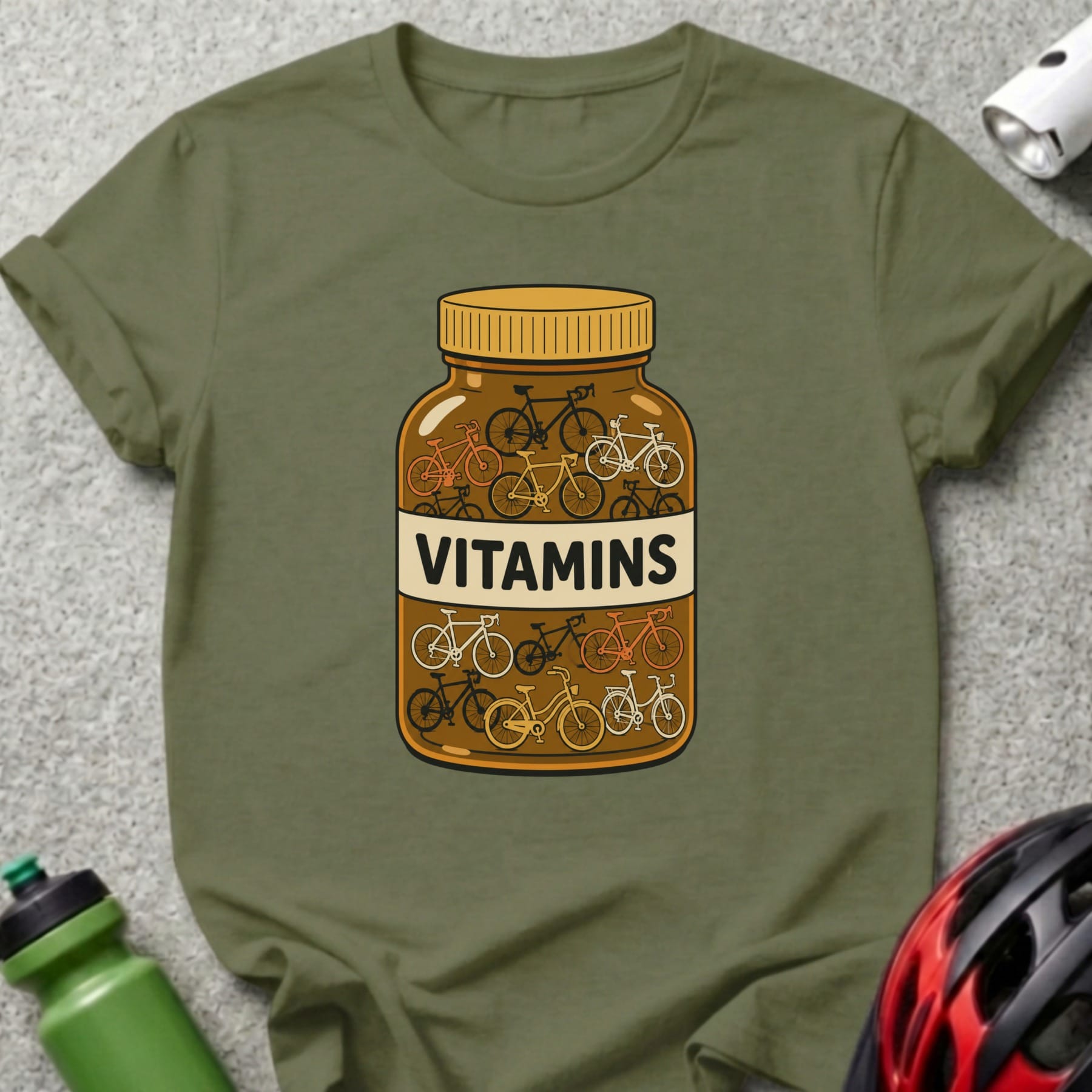 Olive green t-shirt with a bottle labeled "VITAMINS" filled with bicycles.
