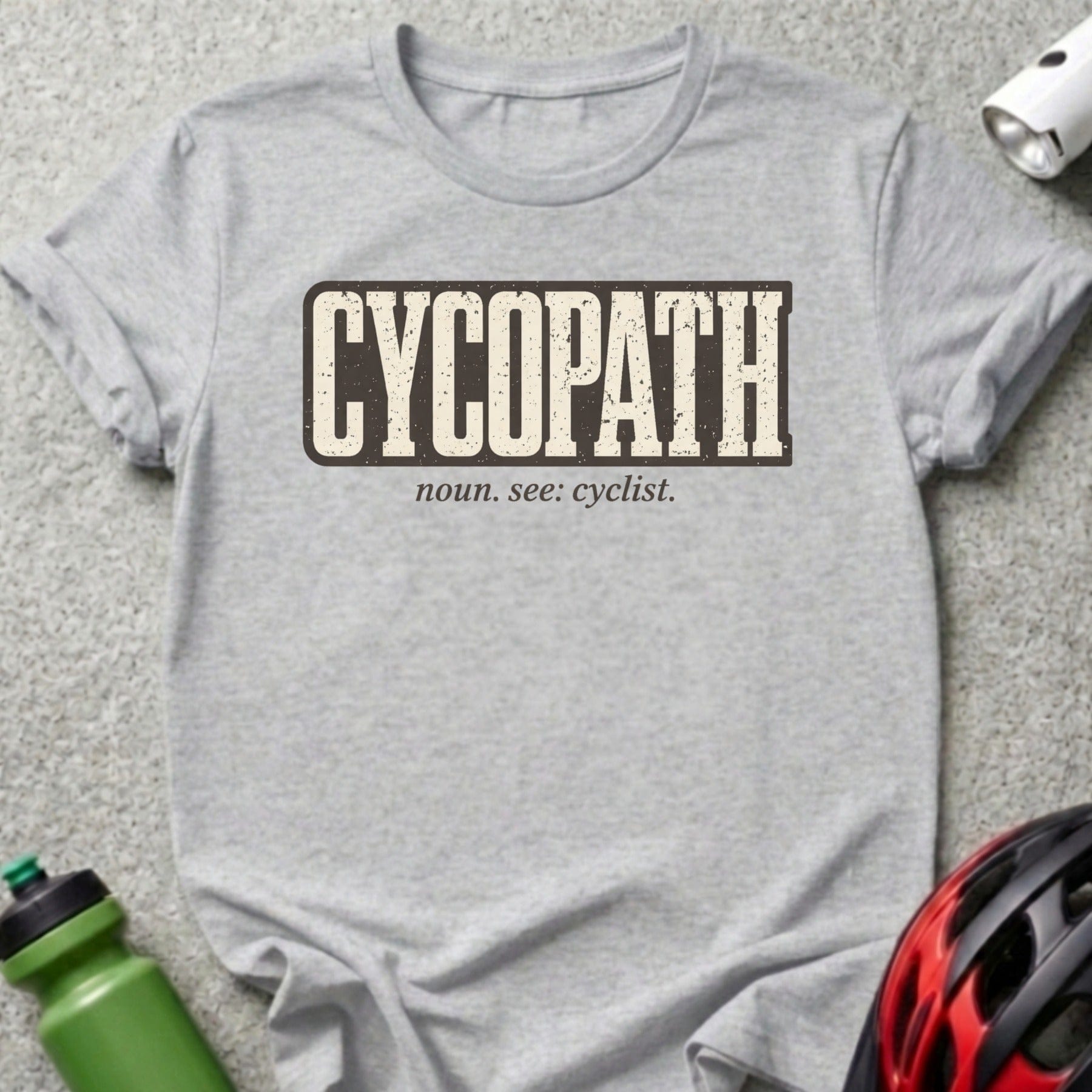Gray t-shirt with "CYCOPATH noun. see: cyclist." text in a vintage style.