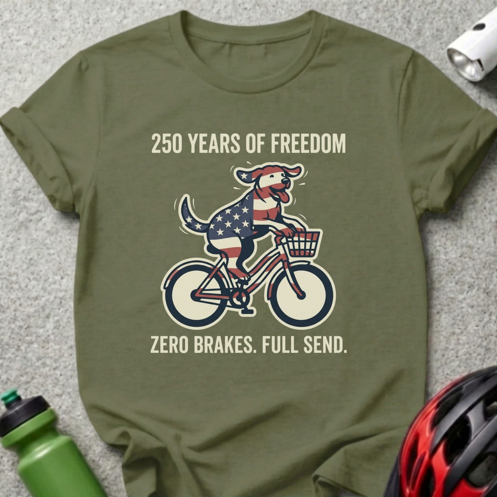 Dog in American flag bandana rides bicycle with text "250 YEARS OF FREEDOM".