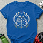Blue t-shirt with "GRIT. GEARS. GLORY." text and bicycle gear graphic.
