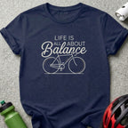 Navy t-shirt with white text and bicycle graphic: "Life is all about Balance."
