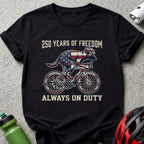 Black t-shirt with "250 Years of Freedom Always on Duty" and patriotic dog on a bicycle.