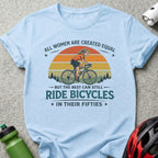 Light blue t-shirt with vintage cyclist graphic and text "All women are created equal but the best can still ride bicycles in their fifties".