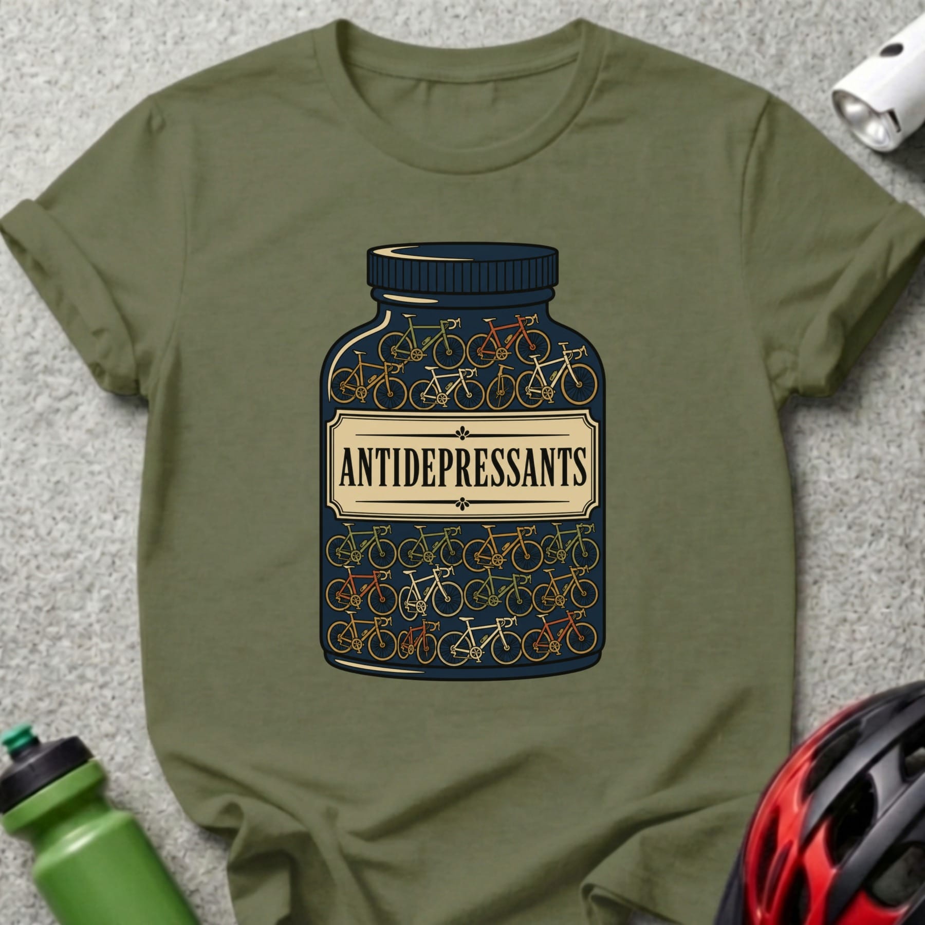 Olive green t-shirt with a bottle of bicycles labeled "Antidepressants".