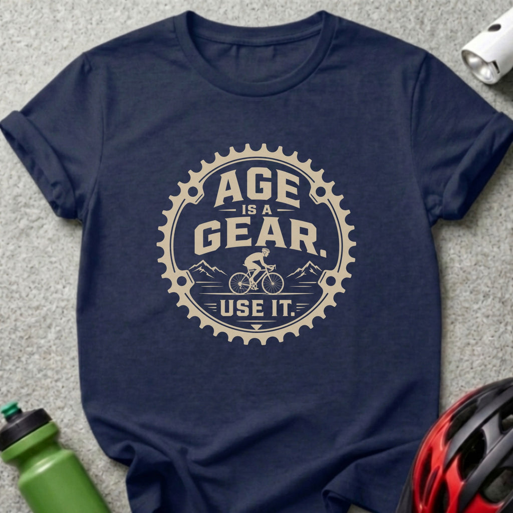 Navy t-shirt with a beige graphic stating "AGE IS A GEAR. USE IT."