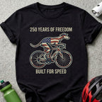 Black t-shirt with a dog on a bicycle, American flag details, and text.