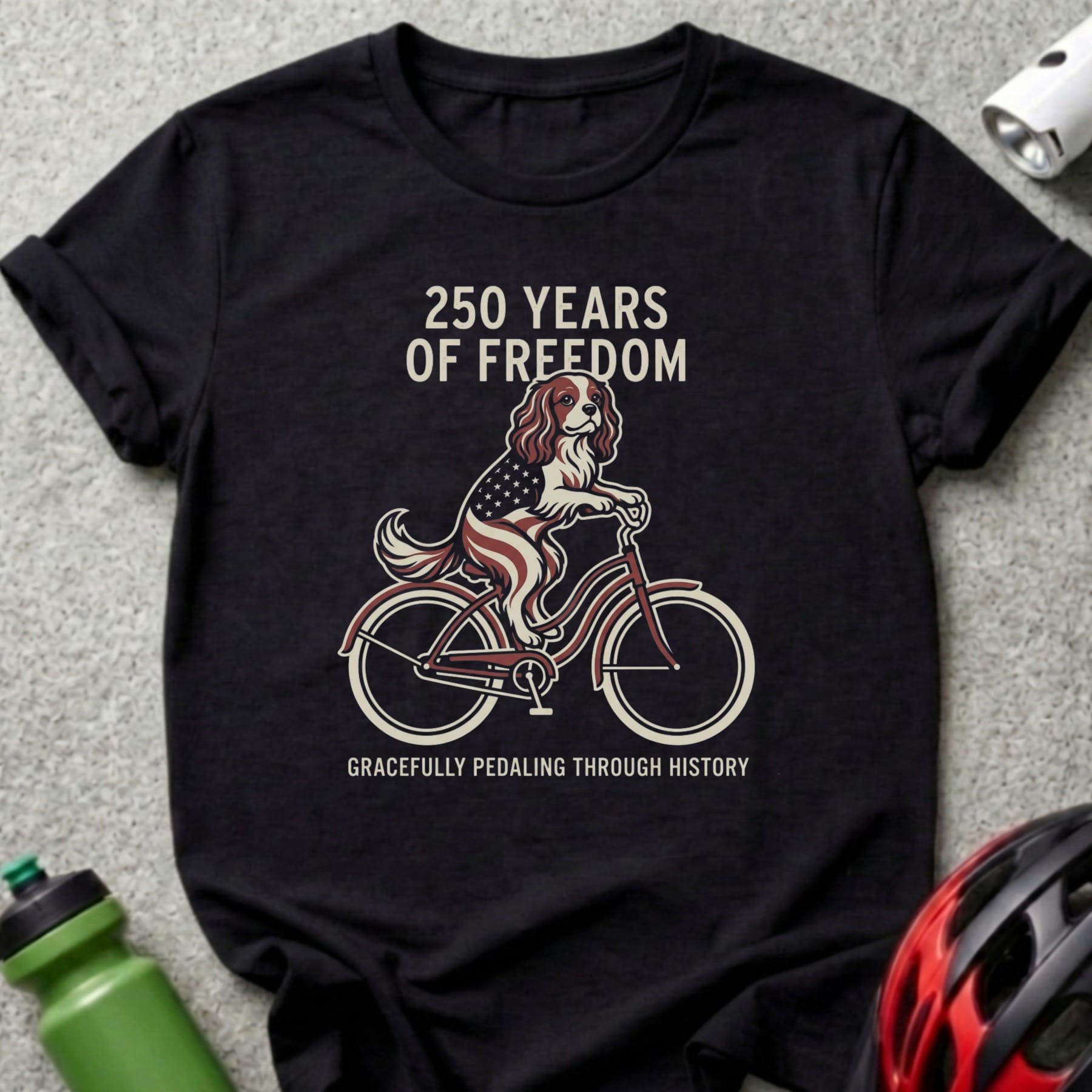 Dog in American flag bandana rides bicycle, "250 Years of Freedom" text.