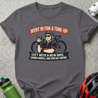 T-shirt with graphic of cyclist and text "WENT IN FOR A TUNE-UP LEFT WITH A NEW BIKE, CARBON WHEELS, AND ZERO SELF CONTROL".