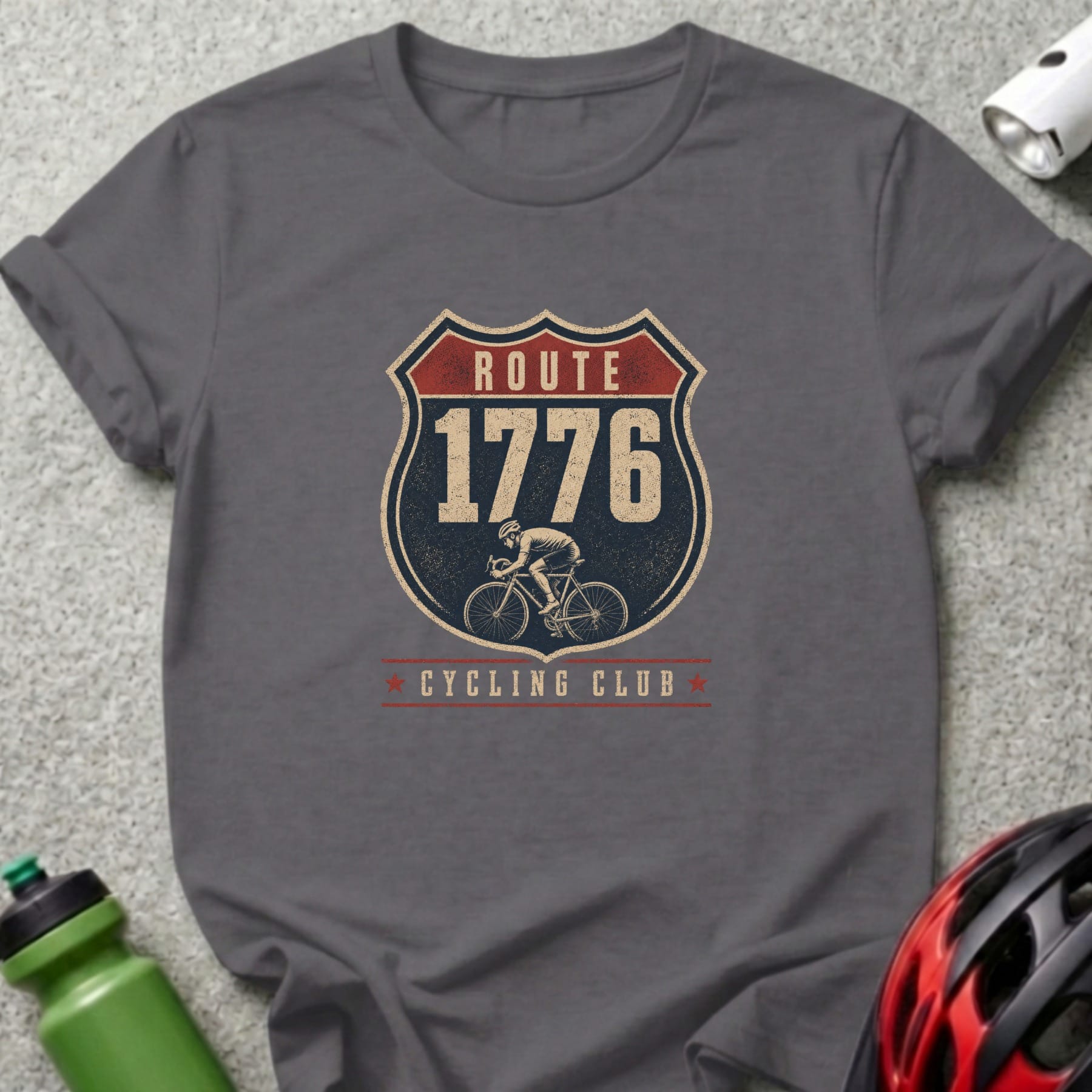 T-shirt with "Route 1776 Cycling Club" badge featuring a cyclist silhouette.