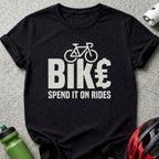 Black t-shirt with "BIKE €" graphic and "SPEND IT ON RIDES" text.