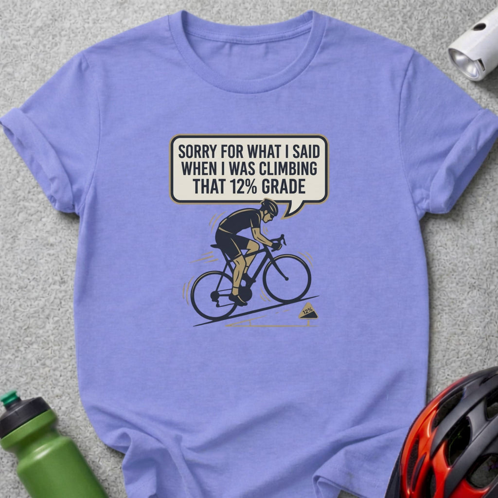 Purple t-shirt with cyclist graphic and text "Sorry for what I said when I was climbing that 12% grade."