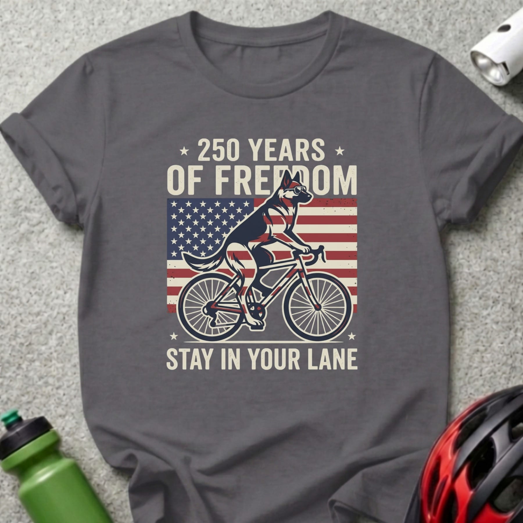 German Shepherd riding a bicycle with American flag and text.