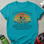 Turquoise t-shirt with graphic of woman biking, text "All women are created equal but the best can still ride bicycles in their fifties."