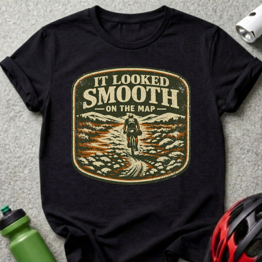 Black t-shirt with distressed graphic of a mountain biker and the text "IT LOOKED SMOOTH ON THE MAP".