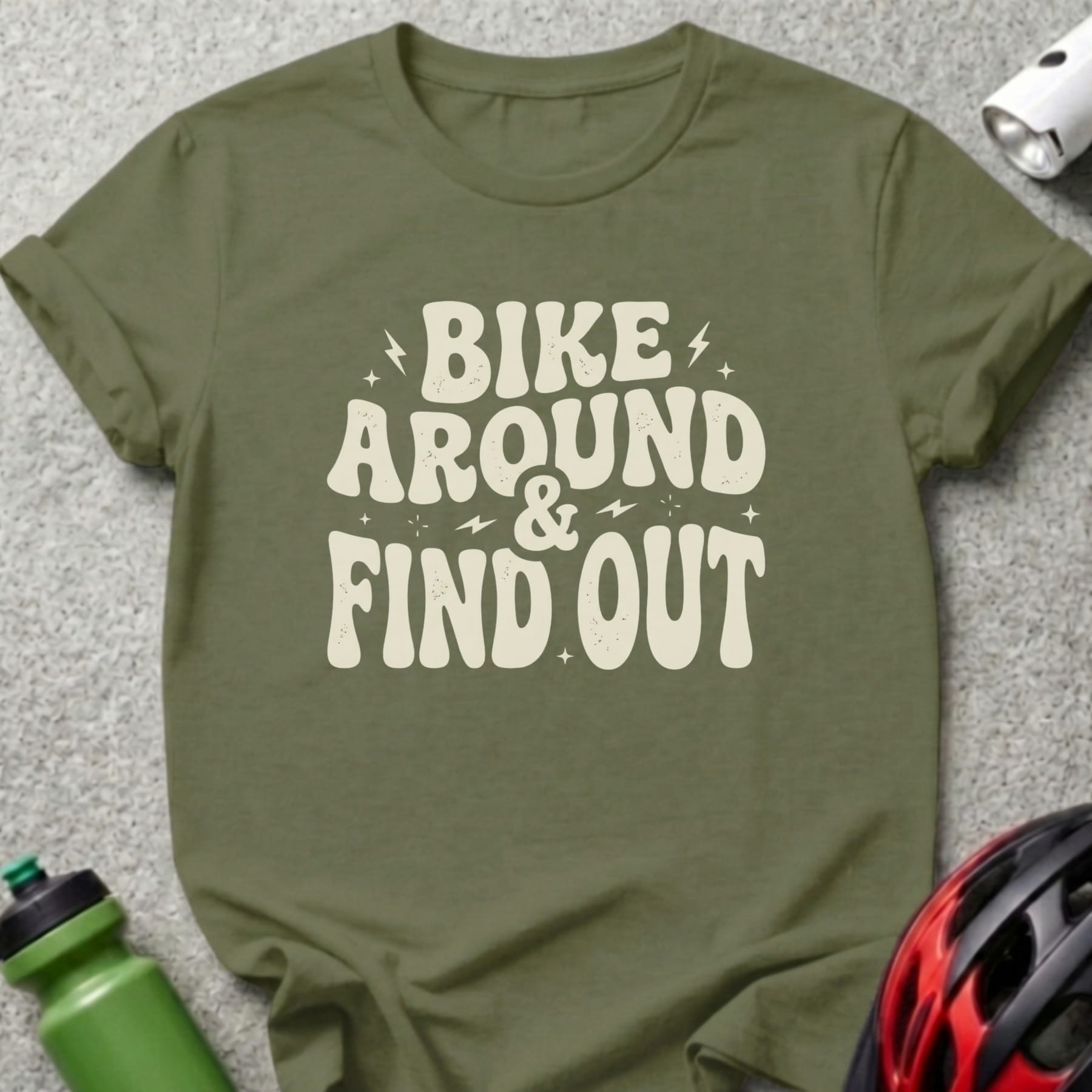 Green t-shirt with "BIKE AROUND & FIND OUT" text in off-white lettering.