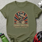 Olive green t-shirt with "CRANKY SINCE 1776 AMERICA 250 - 1776 - 2026" text.