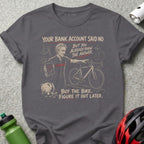 Dark t-shirt graphic shows man pointing at bicycle with text about buying a bike.