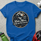 Blue t-shirt with "Ride More, Drink Better Coffee" graphic featuring cyclist and coffee cup.