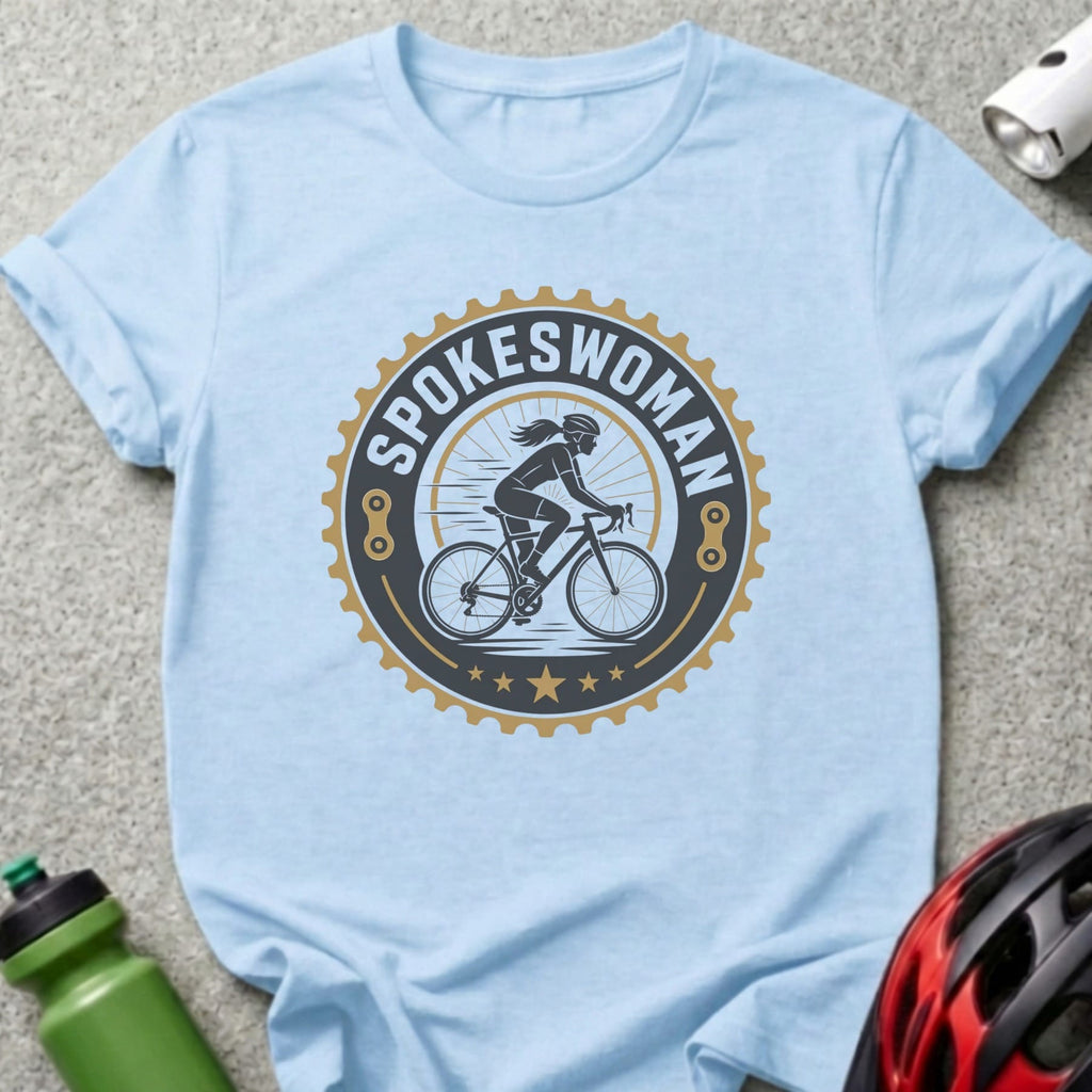 Light blue t-shirt with "SPOKESWOMAN" cycling graphic.