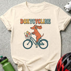 Dog wearing headphones rides a bicycle with medicine in basket.