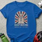 Blue t-shirt with "KEEP MOVING AMERICA 250 1776-2026" text and a bicycle wheel design.