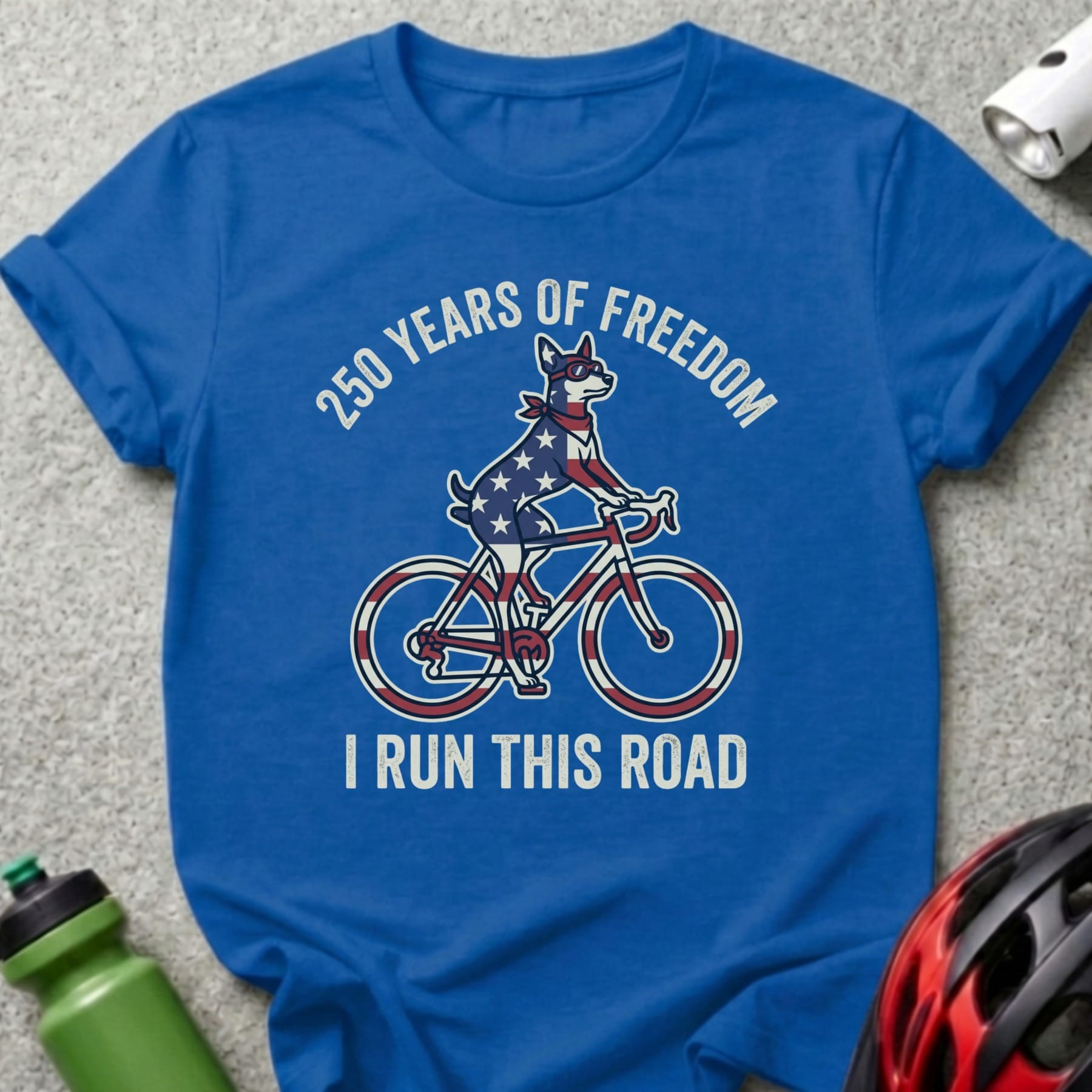Blue t-shirt with dog on bicycle, "250 Years of Freedom I Run This Road."