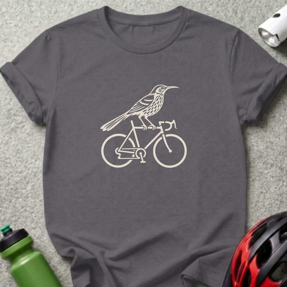 Dark gray crewneck t-shirt featuring a cream-colored graphic of a bird perched on a bicycle.