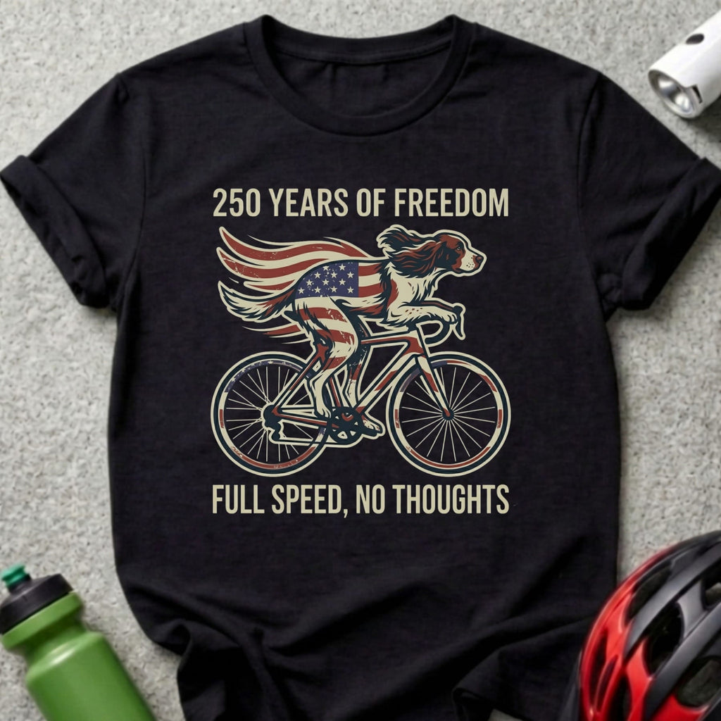Black t-shirt with American flag dog cycling, "250 Years of Freedom Full Speed, No Thoughts".