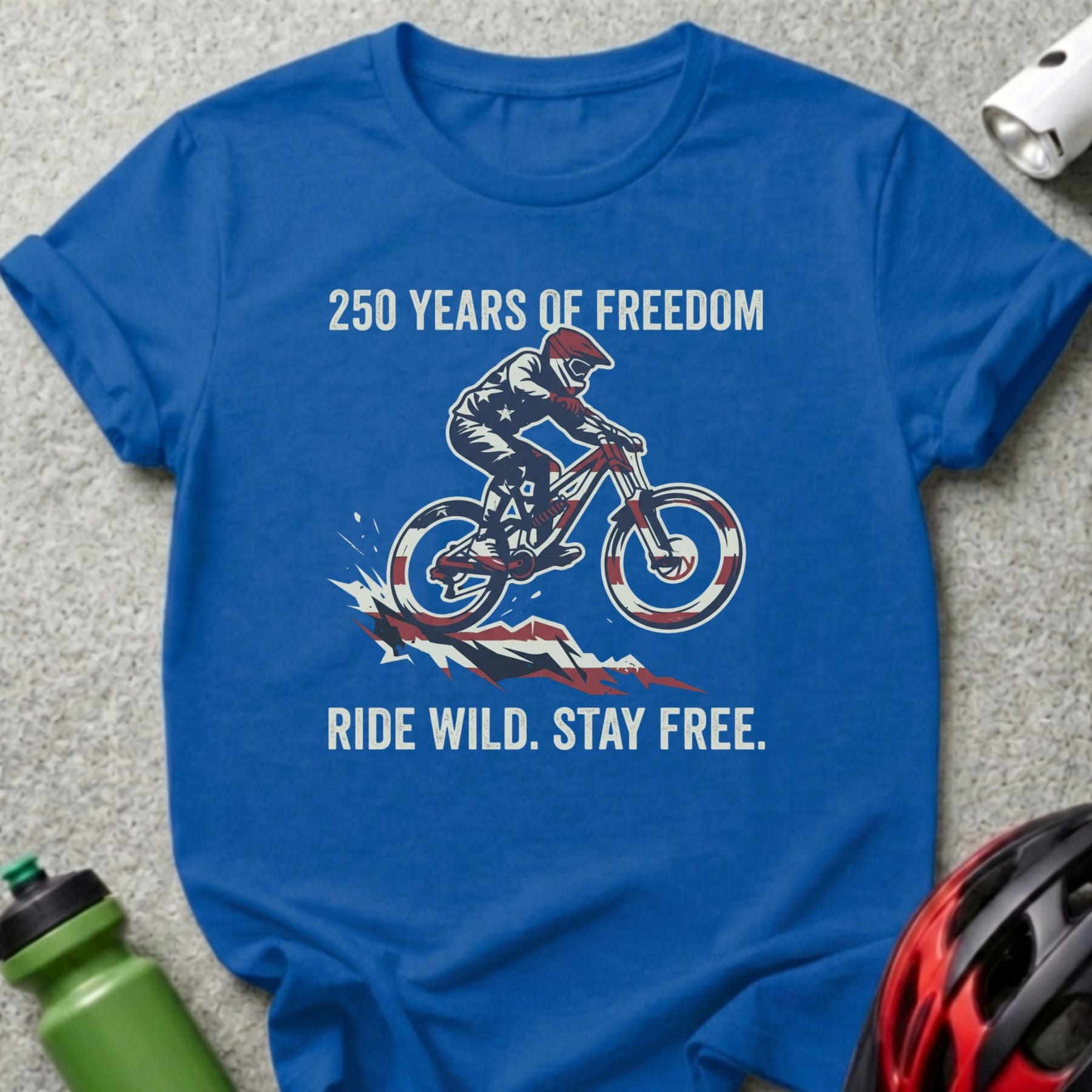 Blue t-shirt with "250 Years of Freedom Ride Wild Stay Free" and a biker.