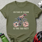 Dog on a bicycle with American flag design, text reads "250 Years of Freedom".