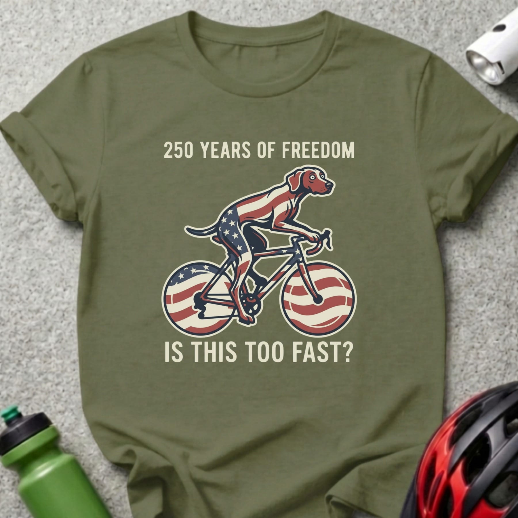Dog on a bicycle with American flag design, text reads "250 Years of Freedom".