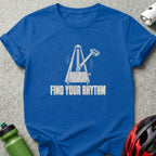 Blue t-shirt featuring a white graphic of a metronome and the text Find Your Rhythm.