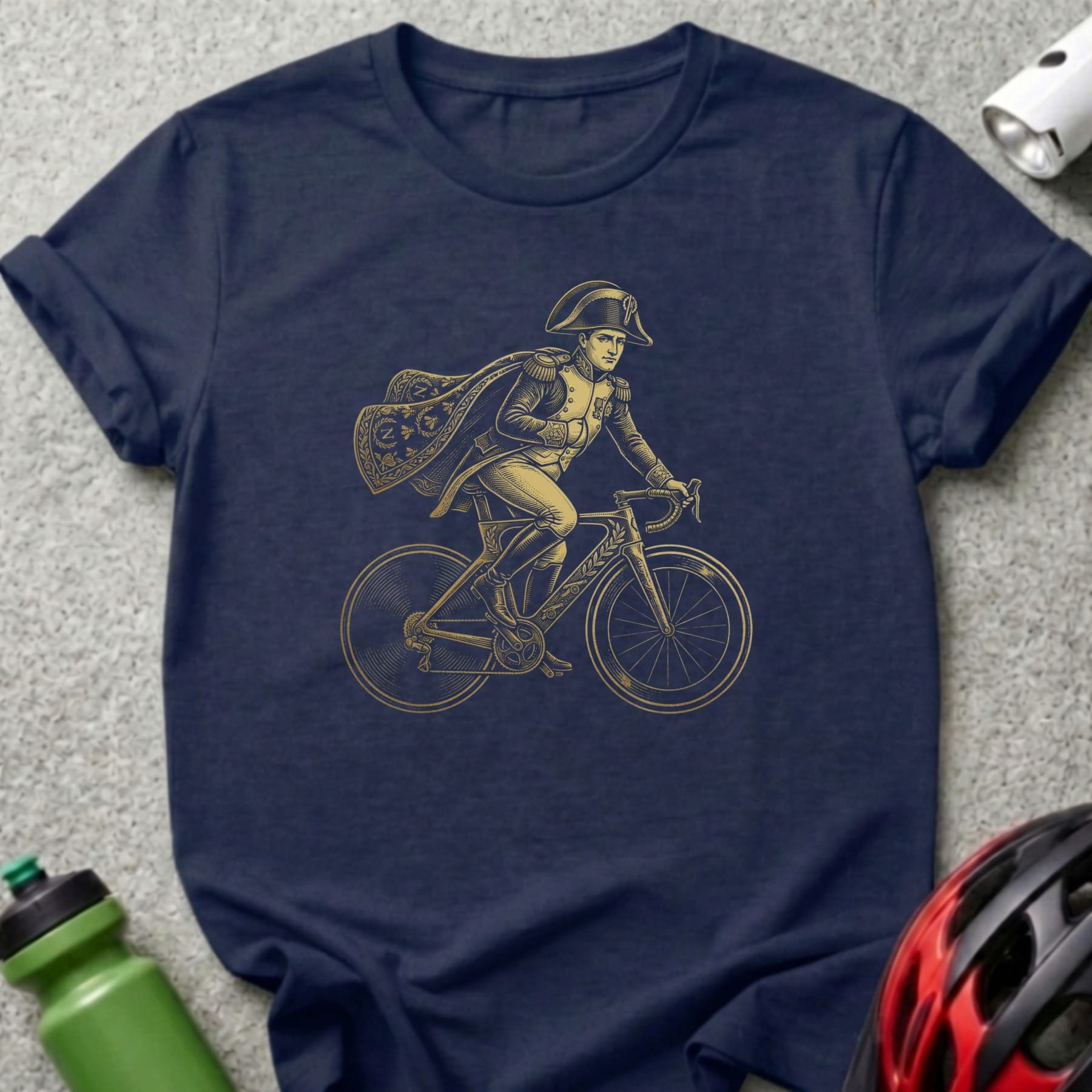 Illustration of Napoleon Bonaparte on a bicycle, printed on a navy t-shirt.
