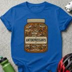 Blue t-shirt with a pill bottle illustration filled with bicycles and running shoes.