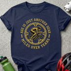 Cyclist within a gear and wheel graphic, text reads "Age is just another gear, miles over years."