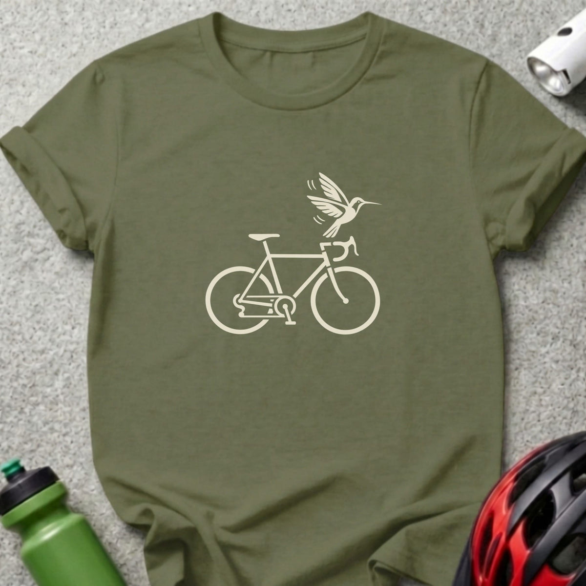 Olive green t-shirt featuring a white graphic of a bicycle with a hummingbird hovering above the handlebars.